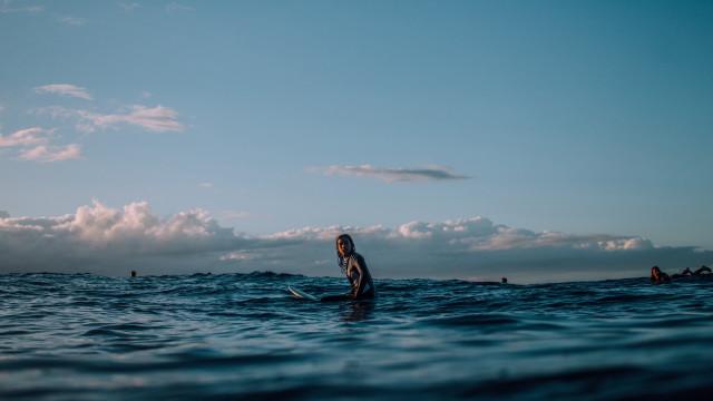 Woman surfboard ocean background clouds free wallpaper - medium preview image