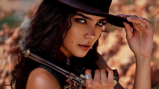 Woman hat gun rocks grass free wallpaper - medium preview image