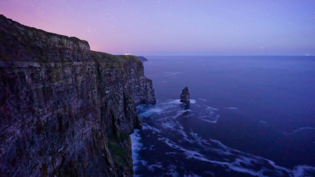 Cliff lighthouse night purple sky free wallpaper - medium preview image