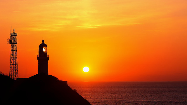 Lighthouse hill sunset moon orange free wallpaper - medium preview image