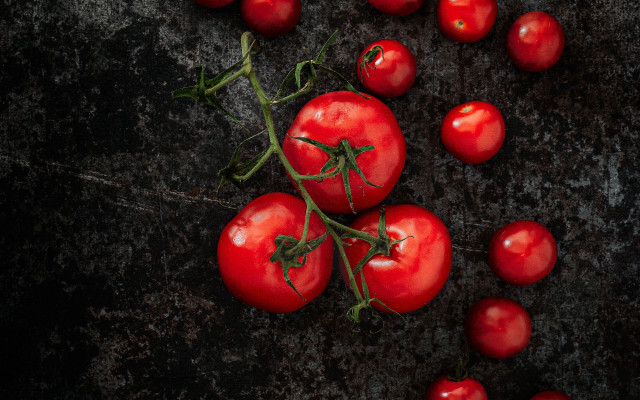 Tomatoes black surface green stems free wallpaper - medium preview image