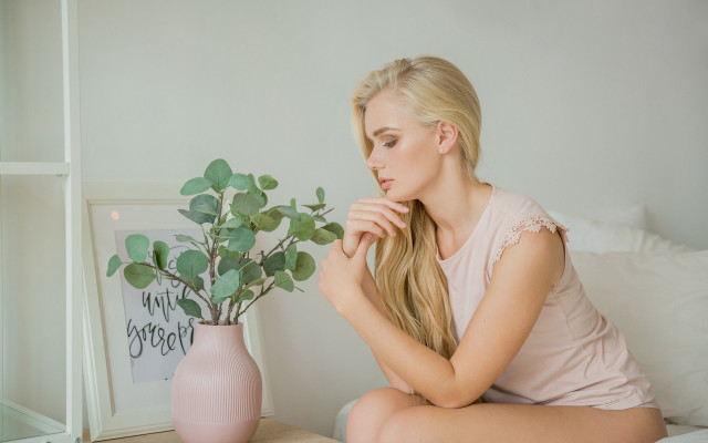 Woman sitting bed plant vase free wallpaper - medium preview image