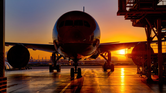 Large jetliner sunset tarmac backlit free wallpaper - medium preview image