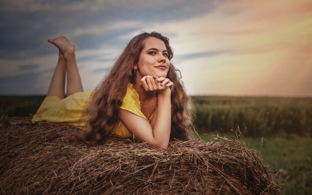 Woman haybale field crossed portrait free wallpaper - medium preview image