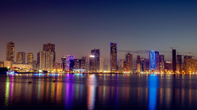 City skyline lake boat night free wallpaper - medium preview image
