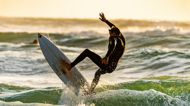 Surfing man wave ocean sunset free wallpaper - medium preview image