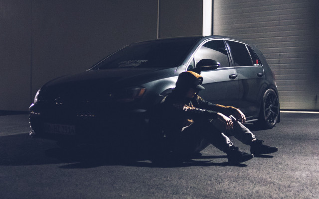 Man sitting car garage open free wallpaper - medium preview image