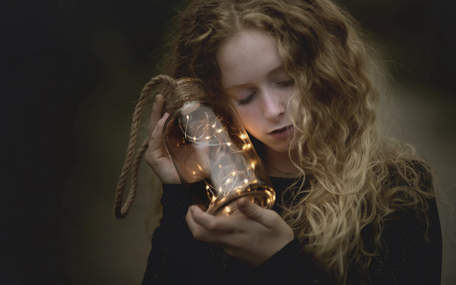 Girl holding glass ball lights free wallpaper - medium preview image