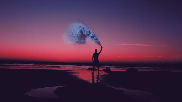 Man beach smoke bomb sunset free wallpaper - medium preview image