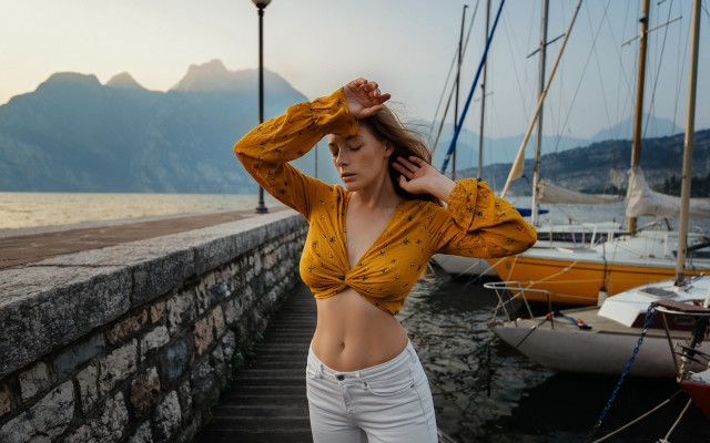 Woman yellow top dock mountains free wallpaper - medium preview image