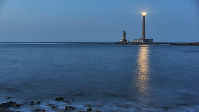 Lighthouse moonlit ocean shore tiltshift free wallpaper - medium preview image