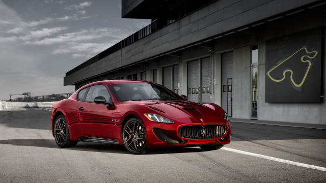 Red sports car building clouds free wallpaper for desktop - medium preview image