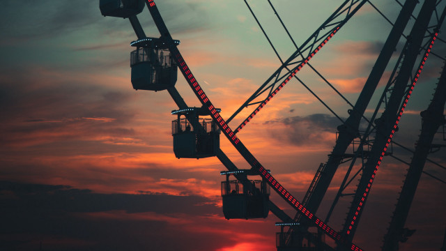 Ferriswheel redlight sunset clouds cityscape free wallpaper - medium preview image