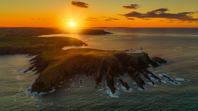 Sunset lighthouse island water sky free wallpaper - medium preview image