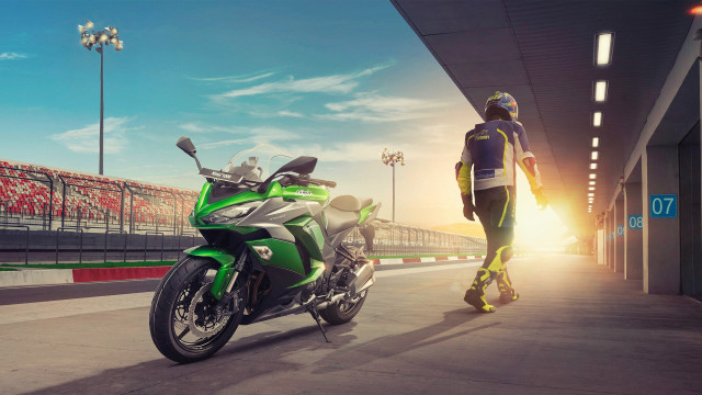 Man motorcycle track building puzzle free wallpaper - medium preview image