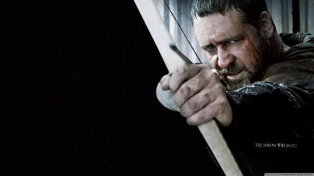 Man holding bow arrow serious free wallpaper - medium preview image