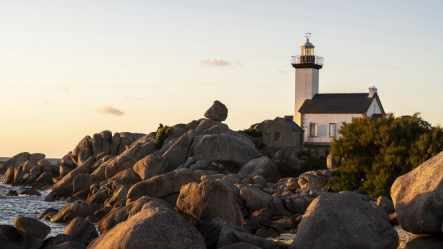 Lighthouse rocky shore dawn mountains free wallpaper - medium preview image