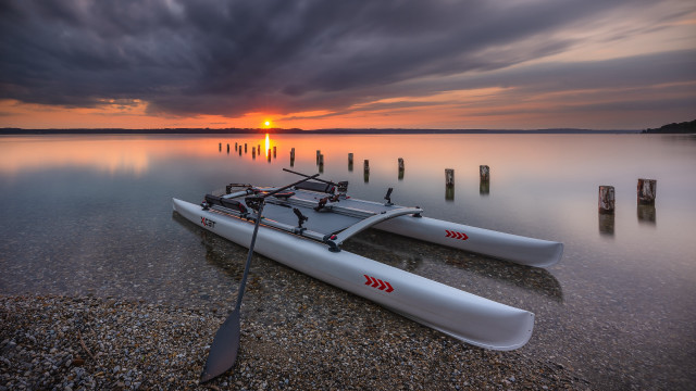 Kayak shore lake sunset cloudy free wallpaper - medium preview image