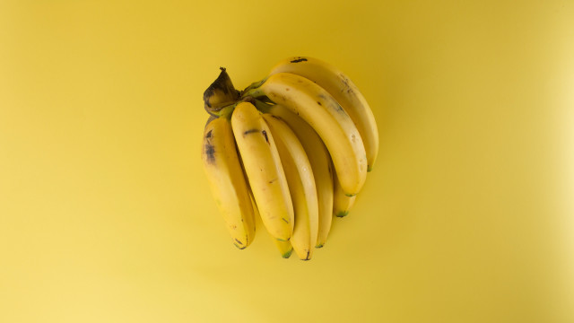 Bananas yellow background black stem free wallpaper - medium preview image