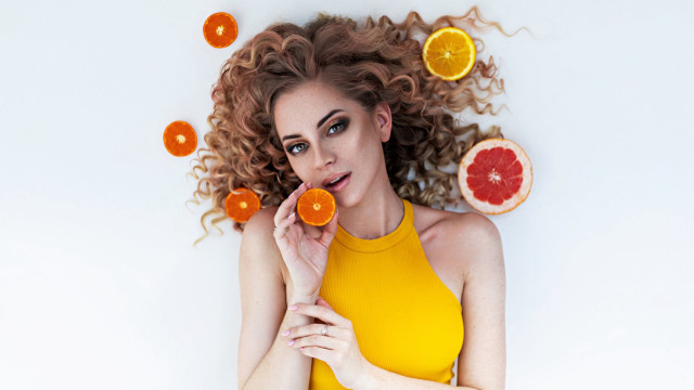 Woman curly hair oranges wind free wallpaper - medium preview image