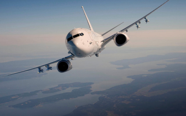 Large jetliner flying blue sky free wallpaper - medium preview image