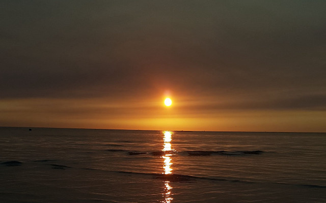 Sunset ocean boat beach person free wallpaper - medium preview image