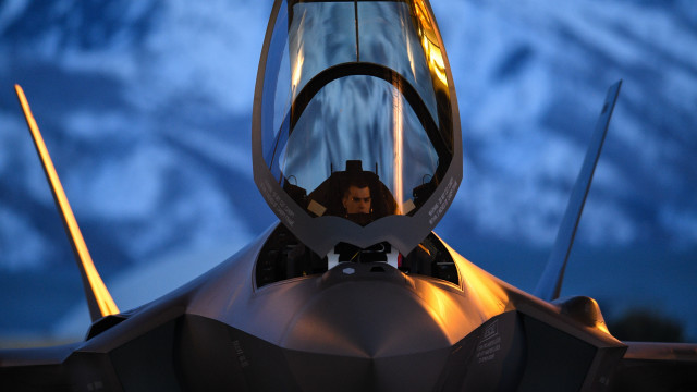 Fighterjet cockpit night mountains blonde free wallpaper - medium preview image