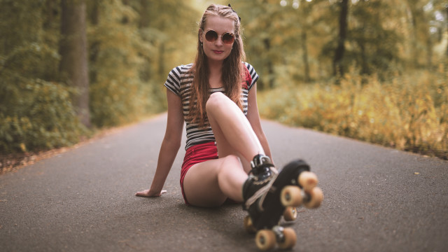 Girl skateboard portrait trees blurry free wallpaper - medium preview image