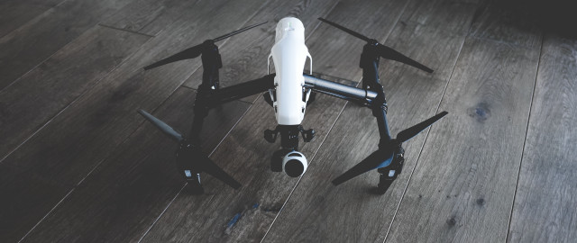 Remote controlled black white drone free wallpaper - medium preview image