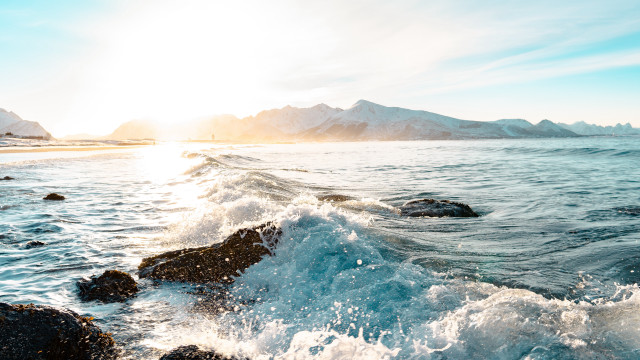 Ocean mountains sun rocks beach free wallpaper - medium preview image