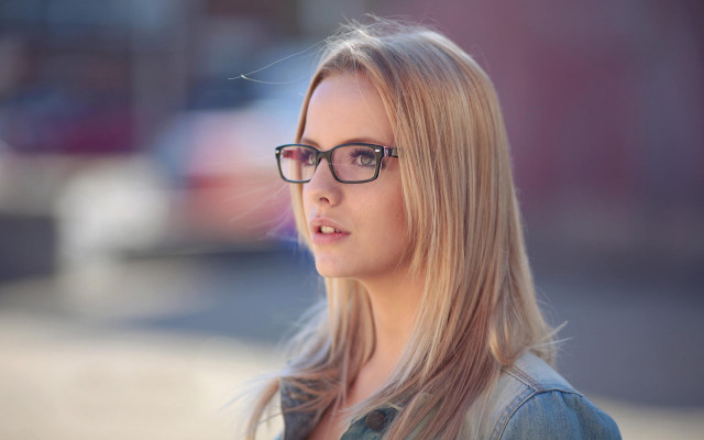 Woman glasses serious portrait blurry free wallpaper - medium preview image