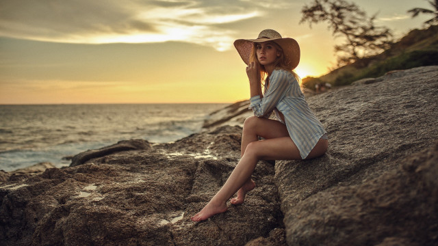Woman sitting rock ocean sunset #2 free wallpaper - medium preview image