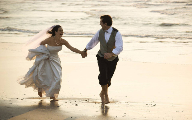 Bride groom beach holding hands free wallpaper - medium preview image
