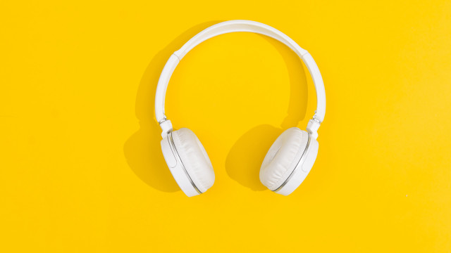 White headphones yellow background shadow free wallpaper - medium preview image