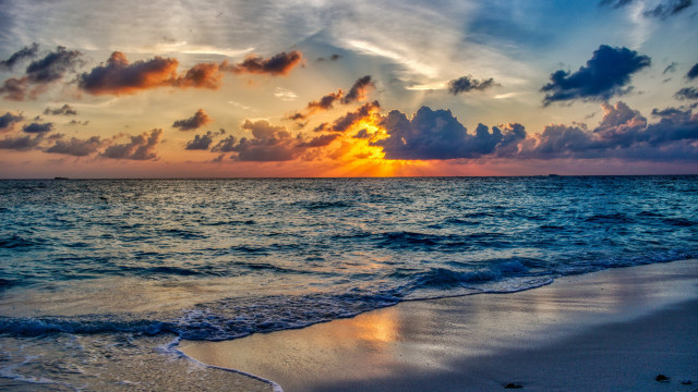 Sunset ocean clouds waves boat free wallpaper - medium preview image
