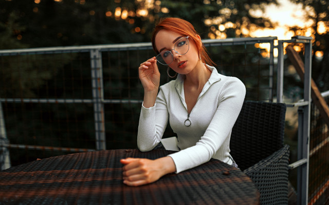 Woman sitting cellphone glasses city free wallpaper - medium preview image