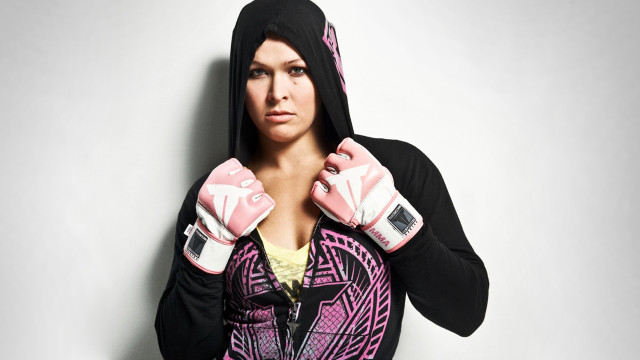 Woman pink gloves black hoodie free wallpaper - medium preview image