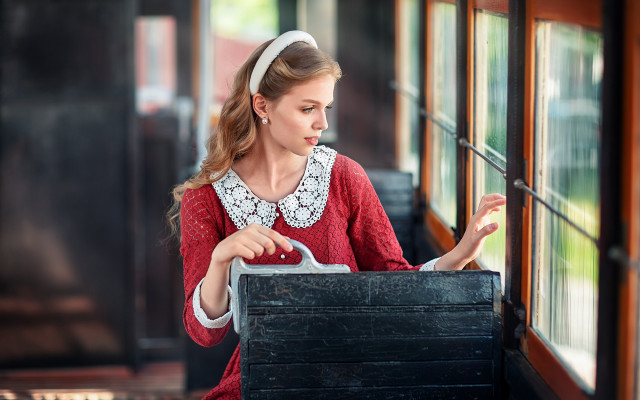 Woman looking window train suitcase free wallpaper - medium preview image