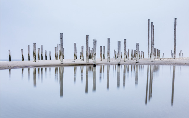 Poles reflection beach land art free wallpaper - medium preview image