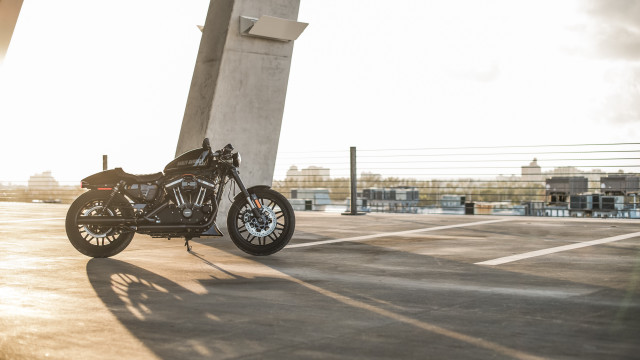 Motorcycle parking lot tall building free wallpaper - medium preview image