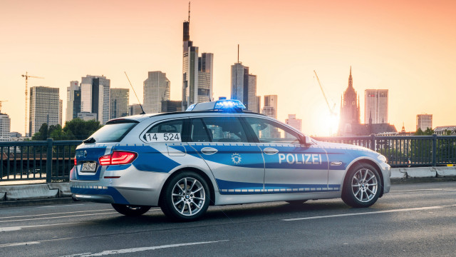 Police car city skyline sunset free wallpaper - medium preview image