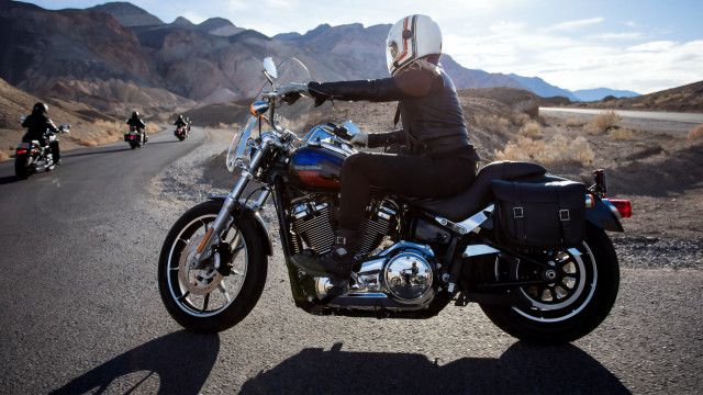 Man riding motorcycle mountains sky free wallpaper - medium preview image