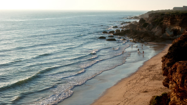 Beach cliff waves people sunset free wallpaper - medium preview image
