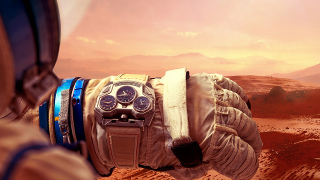 Gloved hand watch desert mountains free wallpaper - medium preview image
