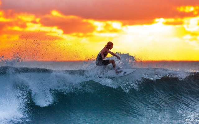 Surfing wave sunset ocean impressionist free wallpaper - medium preview image