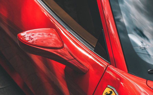 Red ferrari emblem car door free wallpaper - medium preview image