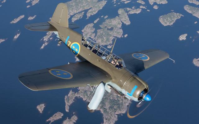 Small plane flying over water free wallpaper - medium preview image