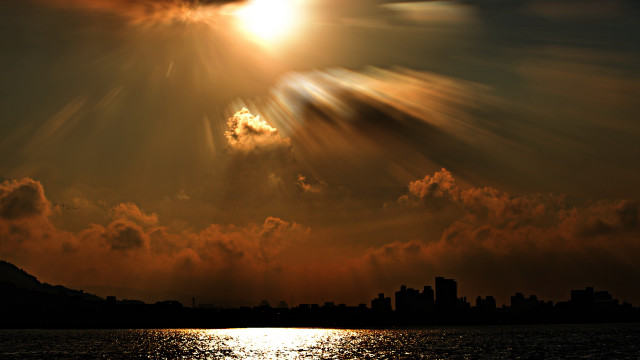 Sunset city clouds bright sunbeam free wallpaper - medium preview image