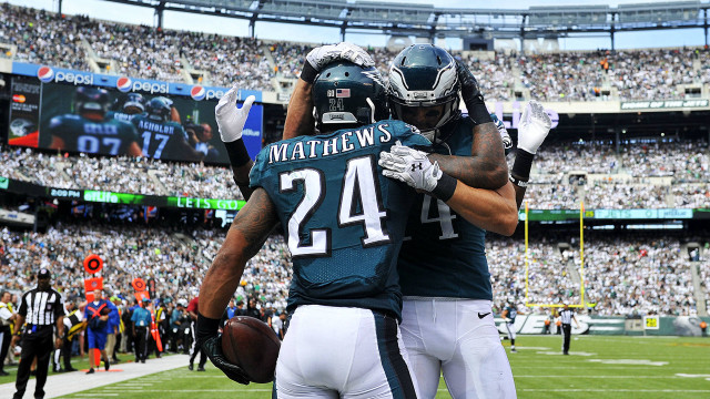 Football players hugging field crowd free wallpaper - medium preview image