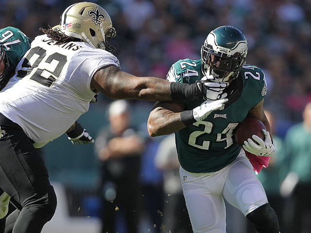 Football player running ball holding free wallpaper - medium preview image
